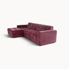 Aika MySofa Nagi loungebank in dieppaars met een getextureerde stoffen bekleding en een modern hoekontwerp.