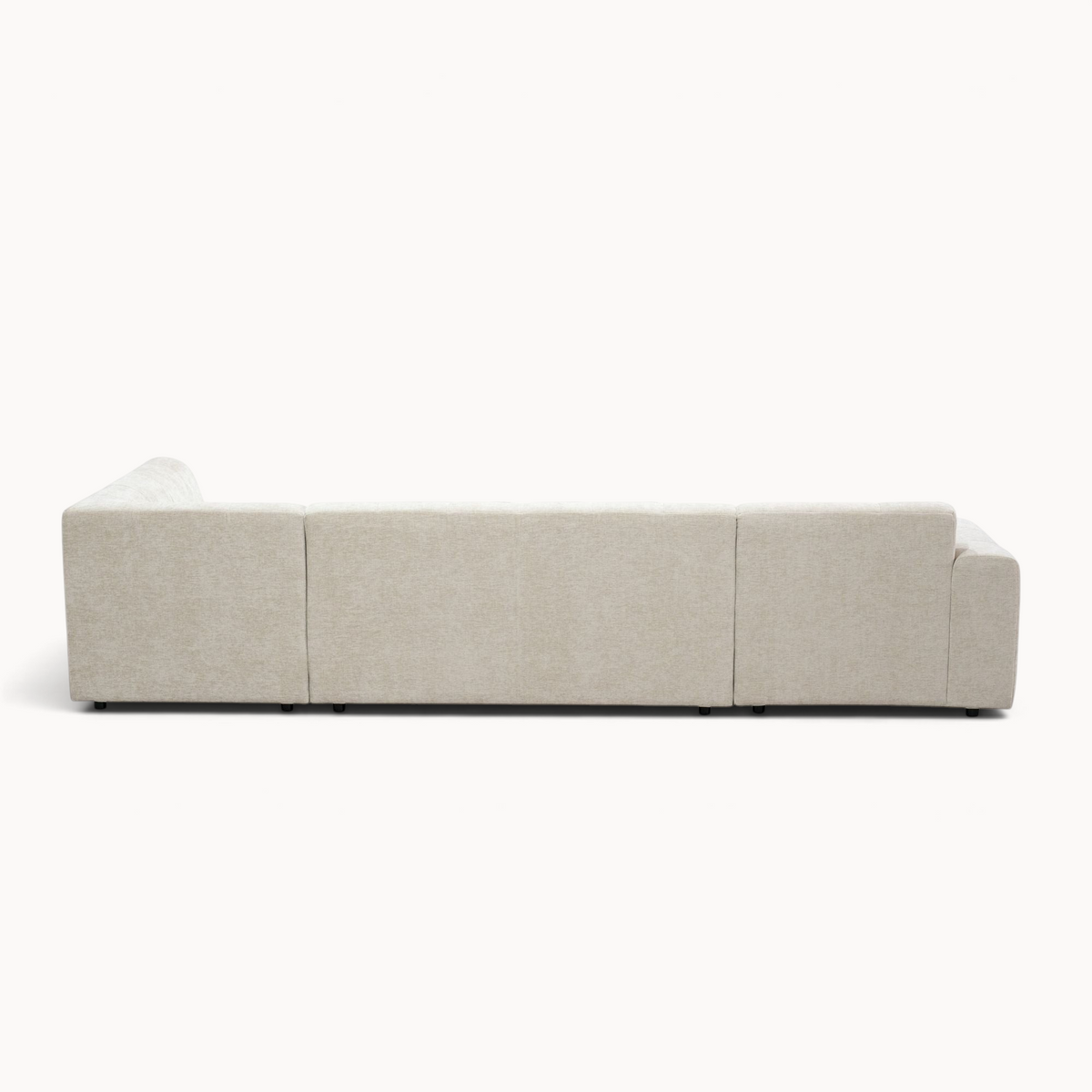 Aika MySofa Nagi U-vormige bank in beige stof, achterkant zichtbaar, modern design met lage poten.