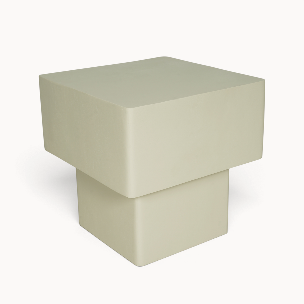 Aika Salontafel Kiezel in een minimalistisch beige ontwerp met een unieke geometrische vorm en gladde afwerking.